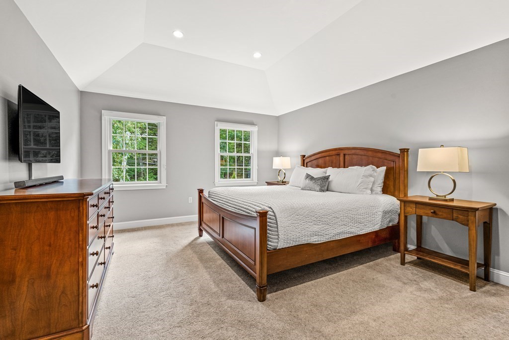 17 Crown Ridge Road Wellesley, MA 02482 - Photo 18 of 37 a bedroom with a bed and a flat screen tv