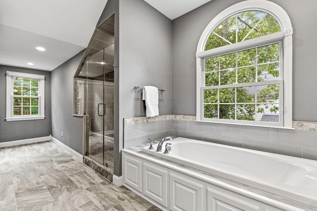 17 Crown Ridge Road Wellesley, MA 02482 - Photo 20 of 37 a bathroom with a bathtub and a shower