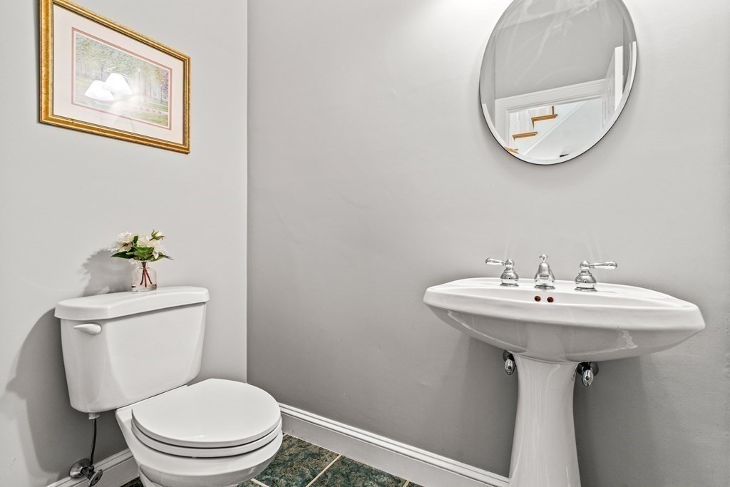 17 Crown Ridge Road Wellesley, MA 02482 - Photo 25 of 37 a bathroom with a toilet a sink and a mirror
