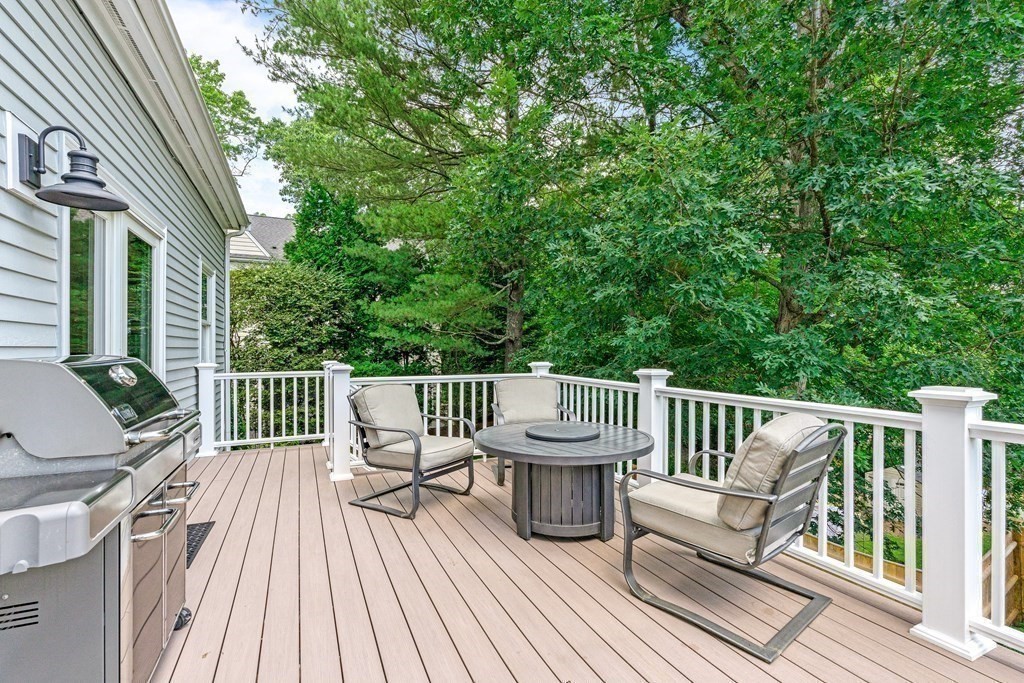 17 Crown Ridge Road Wellesley, MA 02482 - Photo 28 of 37 a view of a two chairs with wooden deck