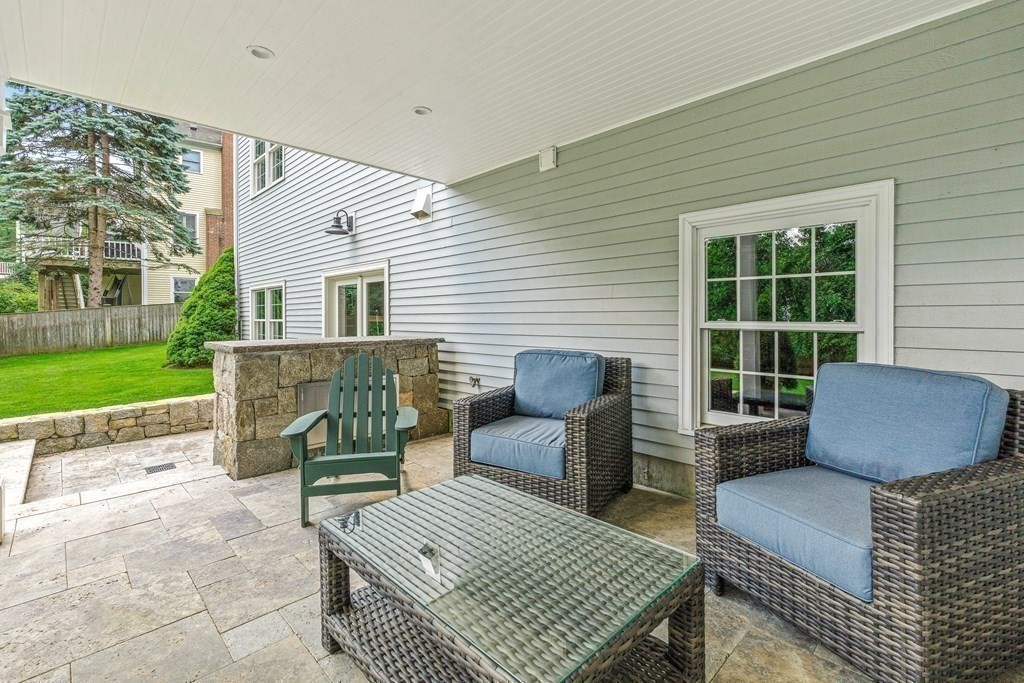 17 Crown Ridge Road Wellesley, MA 02482 - Photo 31 of 37 a view of a patio with couches and a table and chair with garden
