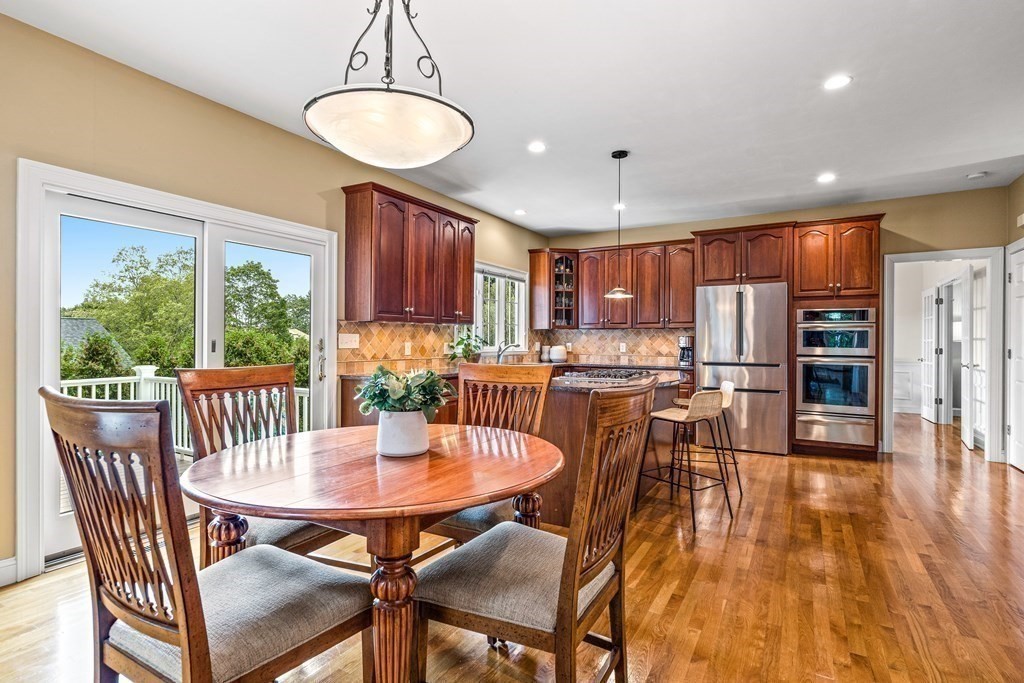 17 Crown Ridge Road Wellesley, MA 02482 - Photo 5 of 37 a dining room with furniture a window and wooden floor