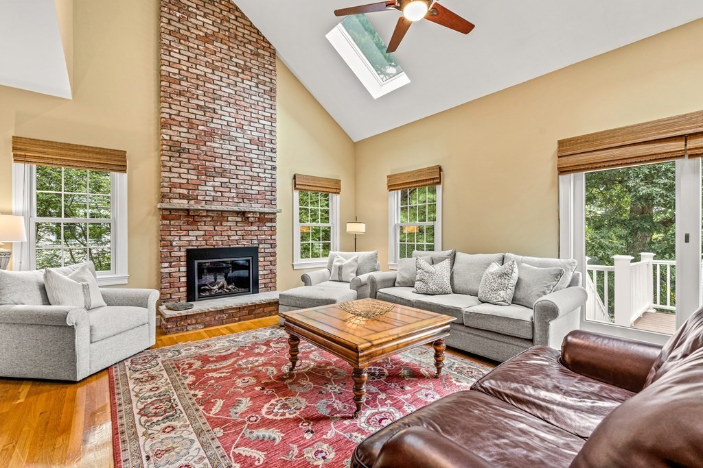 17 Crown Ridge Road Wellesley, MA 02482 - Photo 9 of 37 a living room with furniture fireplace and a large window