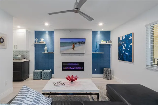 a living room with furniture and a fireplace