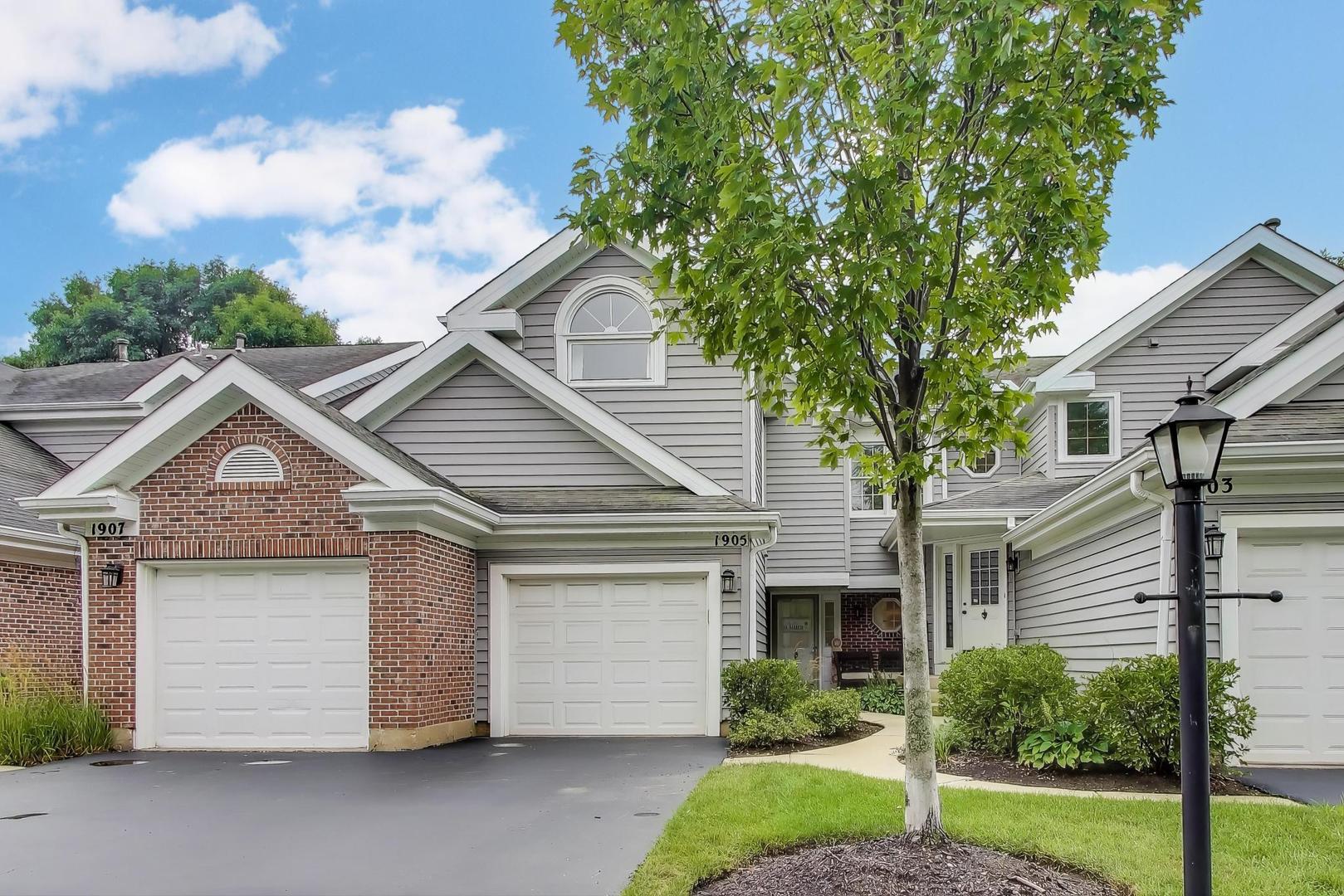 1905 Stillwater Road Arlington Heights, IL 60004 - Photo 1 of 36 a front view of a house with a yard and garage