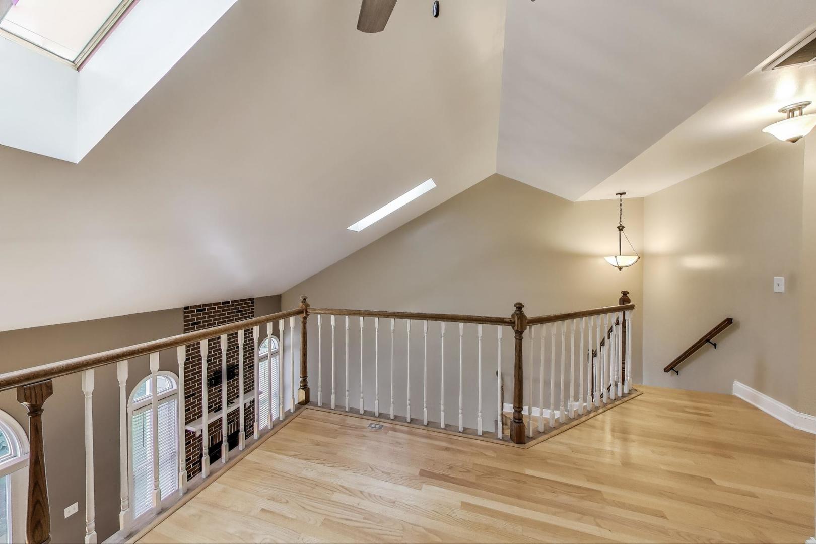 1905 Stillwater Road Arlington Heights, IL 60004 - Photo 19 of 36 a view of staircase with railing and a chandelier