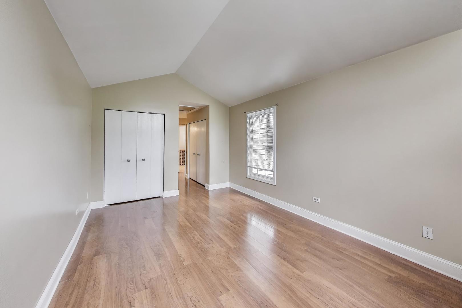 1905 Stillwater Road Arlington Heights, IL 60004 - Photo 21 of 36 a view of an empty room with wooden floor and window
