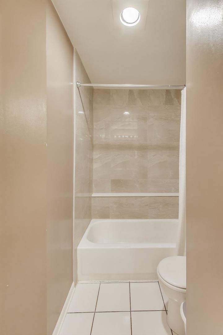1905 Stillwater Road Arlington Heights, IL 60004 - Photo 23 of 36 a bathroom with a shower and a toilet