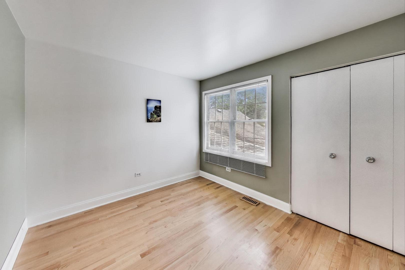 1905 Stillwater Road Arlington Heights, IL 60004 - Photo 24 of 36 an empty room with wooden floor and windows