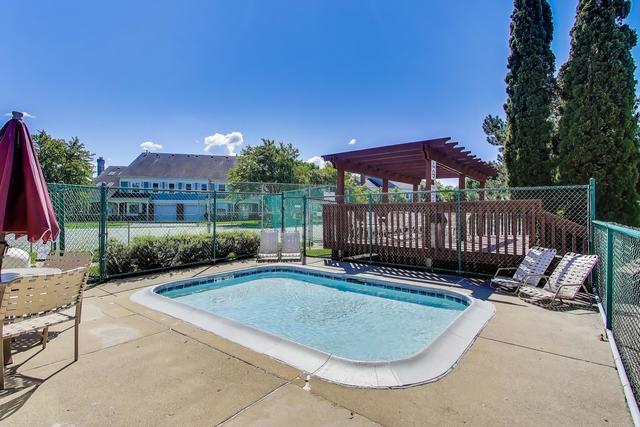 1905 Stillwater Road Arlington Heights, IL 60004 - Photo 31 of 36 a view of a backyard with a small deck and a slide