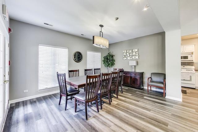 1905 Stillwater Road Arlington Heights, IL 60004 - Photo 36 of 36 a view of a dining room with furniture window and wooden floor
