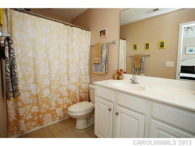 524 Bent Leaf Court Fort Mill, SC 29708 - Photo 13 of 16 a bathroom with a sink and a mirror