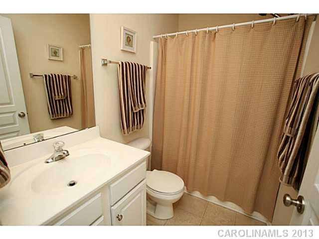 524 Bent Leaf Court Fort Mill, SC 29708 - Photo 16 of 16 a bathroom with a sink and a mirror