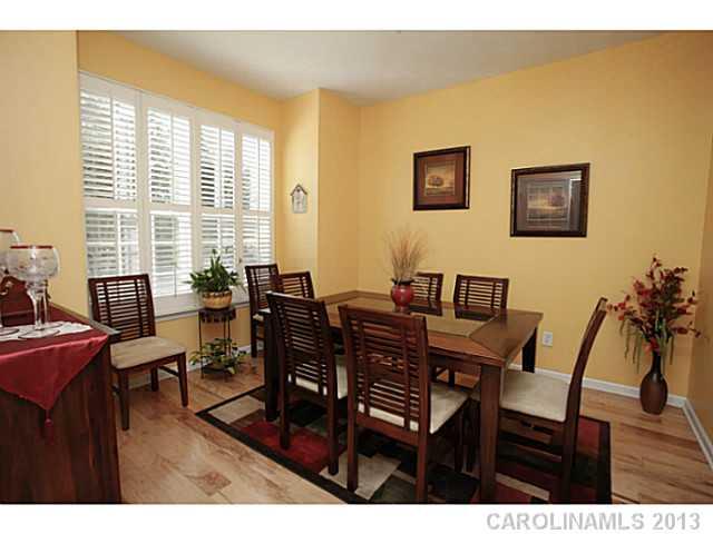 524 Bent Leaf Court Fort Mill, SC 29708 - Photo 3 of 16 a view of a dining room with furniture and a large window