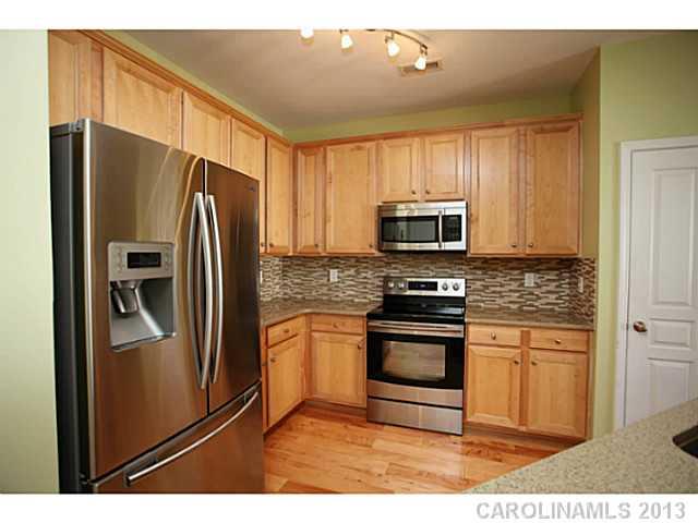 524 Bent Leaf Court Fort Mill, SC 29708 - Photo 8 of 16 a kitchen with stainless steel appliances granite countertop a refrigerator stove and microwave