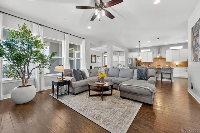 a living room with furniture and a rug