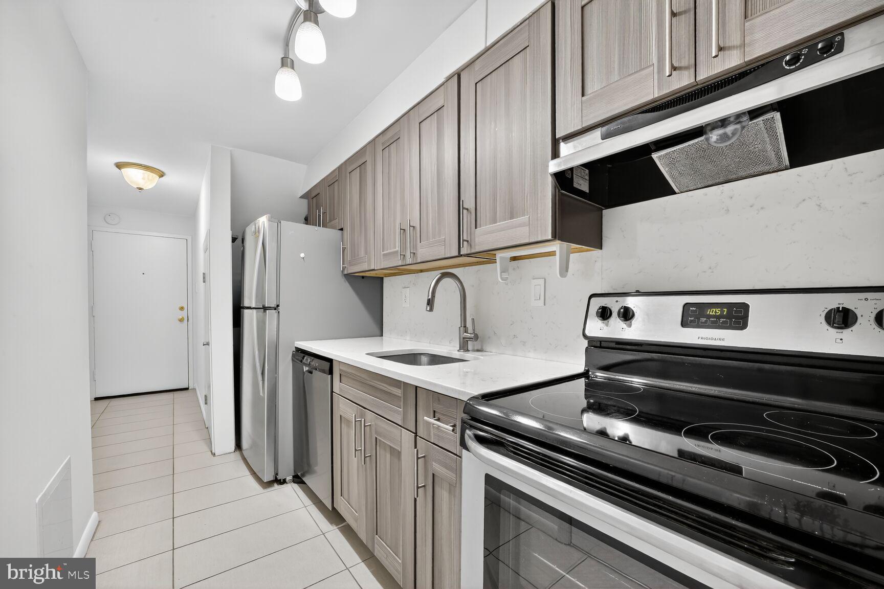 511 P Street Northwest, Unit 2 Washington, DC 20001 - Photo 3 of 15 a kitchen with a stove and a microwave
