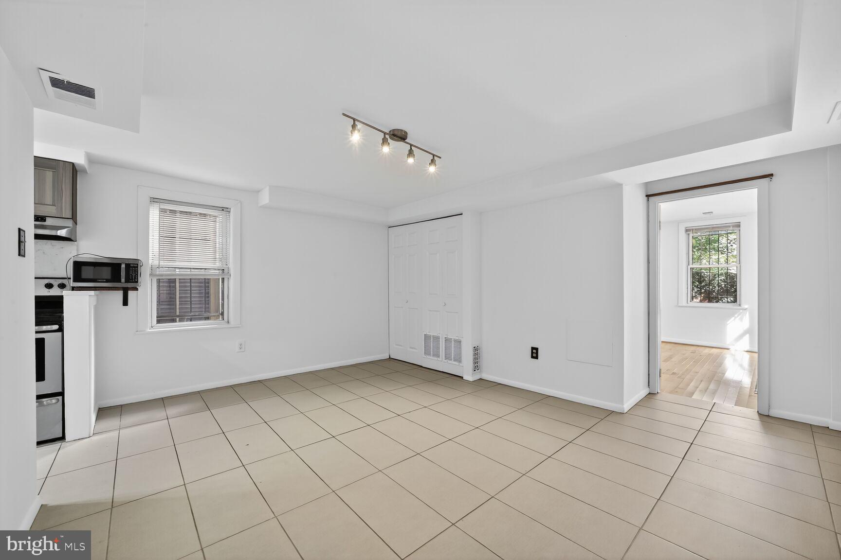 511 P Street Northwest, Unit 2 Washington, DC 20001 - Photo 6 of 15 a view of an empty room with window