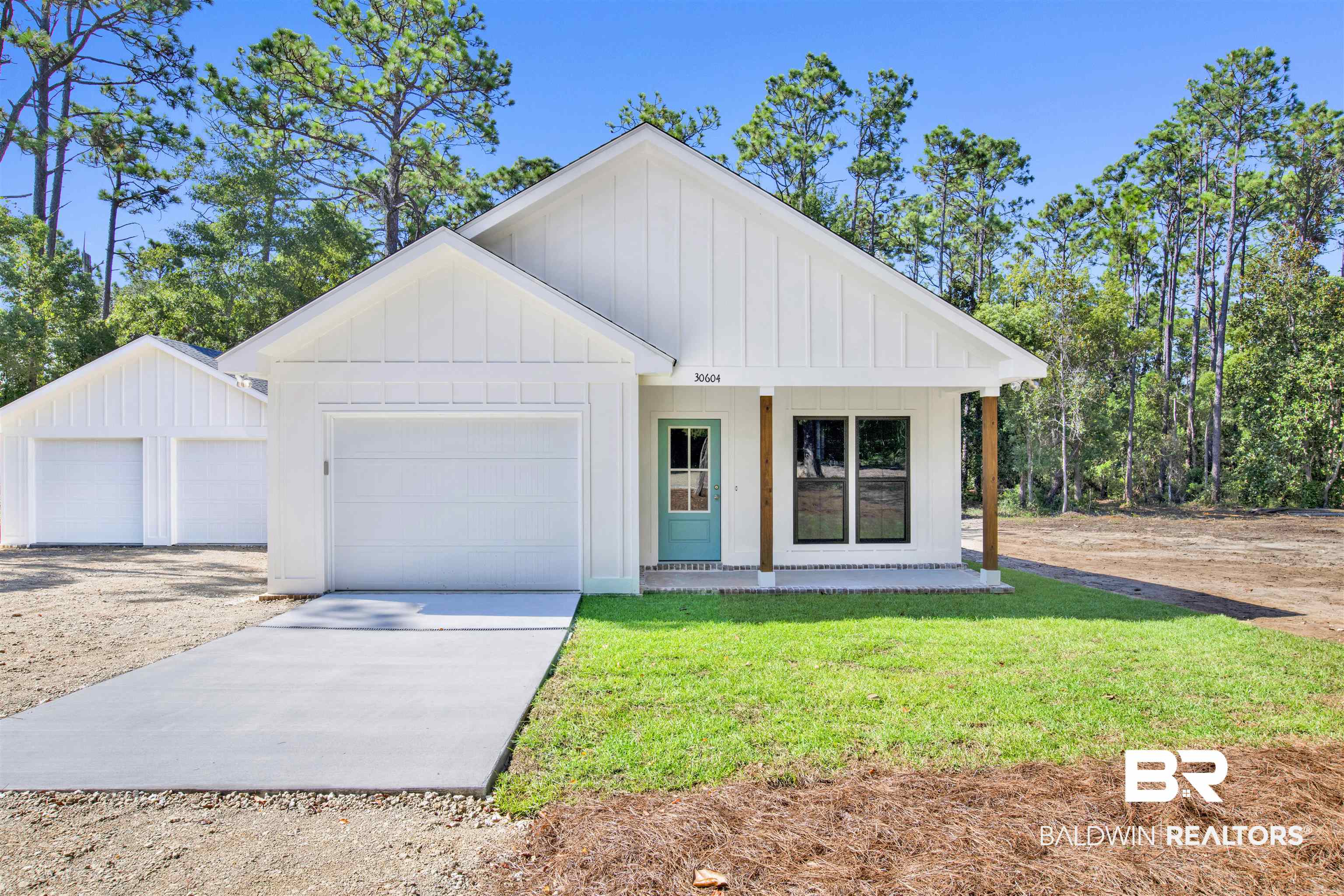 30604 Orange Street Elberta, AL 36530 - Photo 1 of 27 Modern inspired farmhouse featuring covered porch, a garage, and a front yard