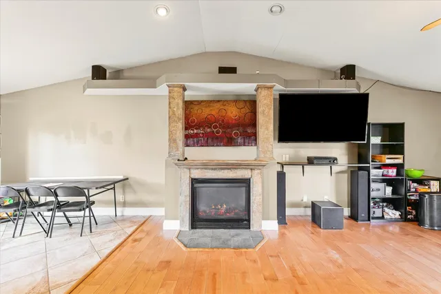 a view of a livingroom with furniture and a flat screen tv