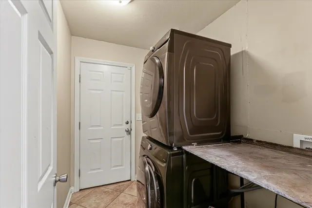 a utility room with a sink a washer and dryer