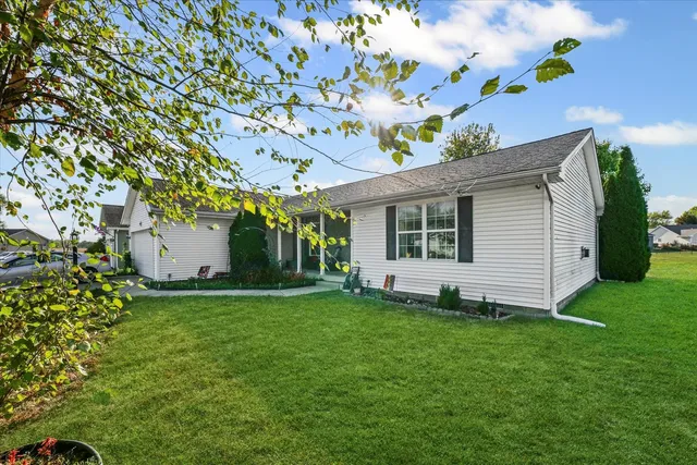 a view of a house with a yard