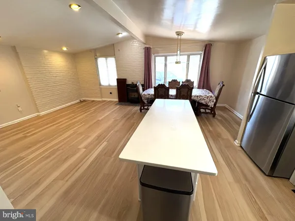 a view of kitchen with granite countertop window