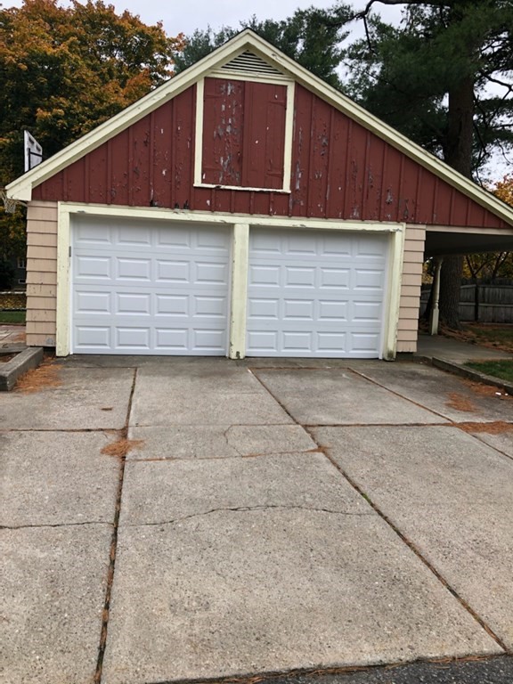 a side view of a house with a garage