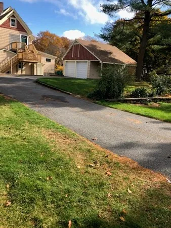 a view of house with yard