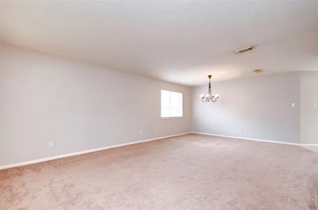 an empty room with a empty space and window