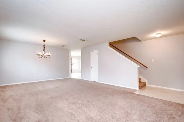 a view of a room with a ceiling fan