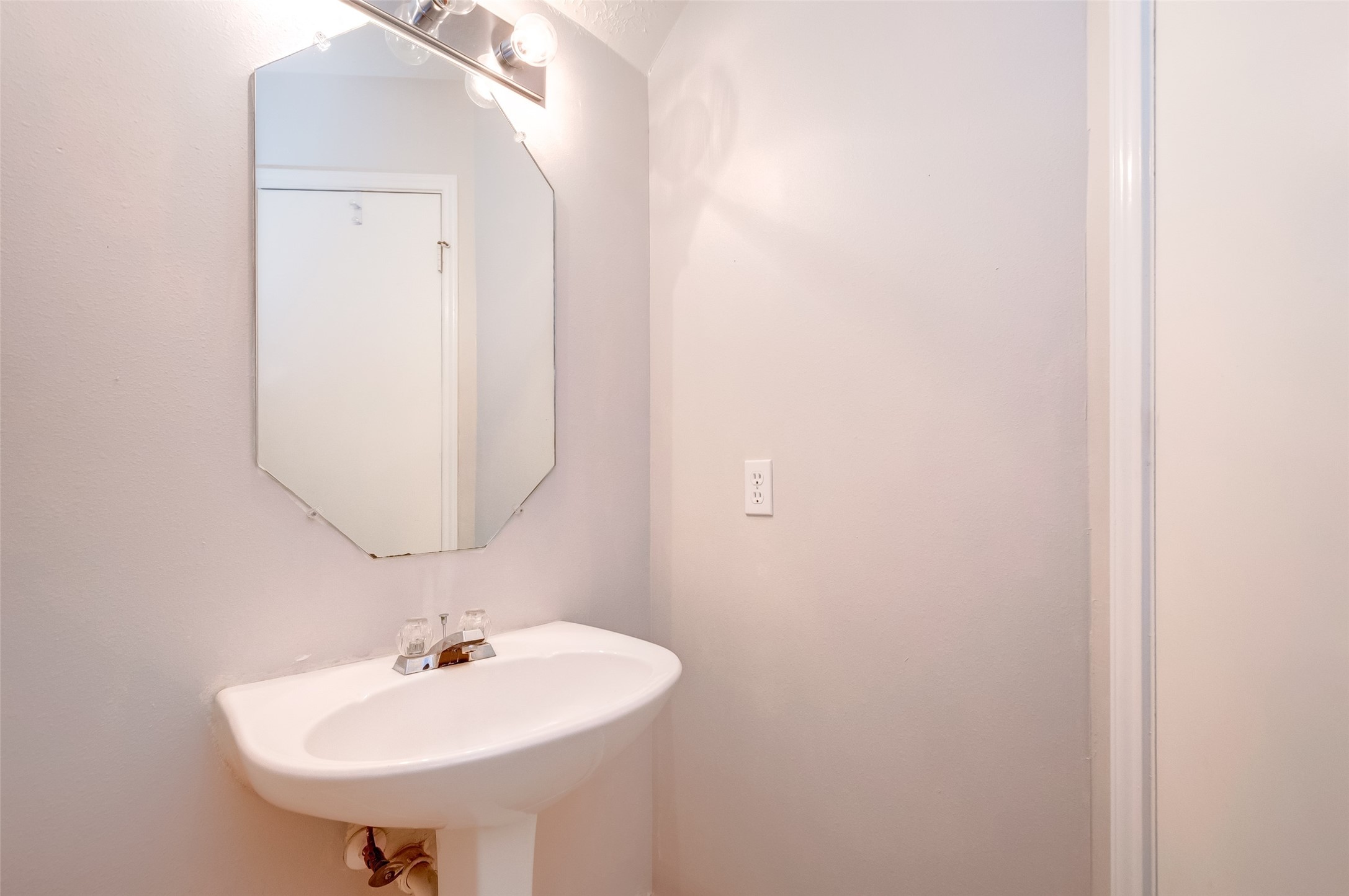 12654 Pine Bush Drive Houston, TX 77070 - Photo 19 of 35 a bathroom with a sink and a mirror