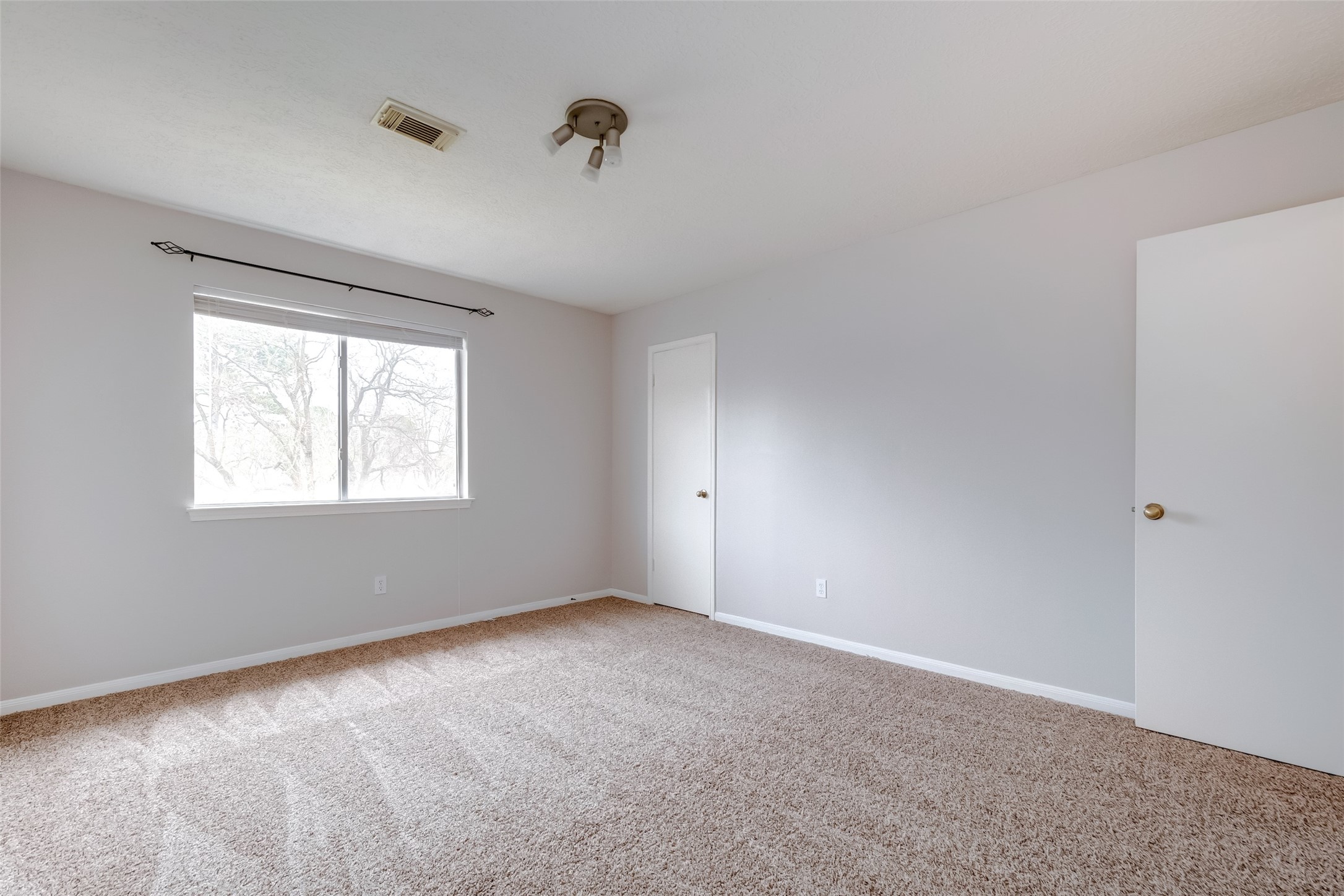 12654 Pine Bush Drive Houston, TX 77070 - Photo 24 of 35 a view of an empty room with a window