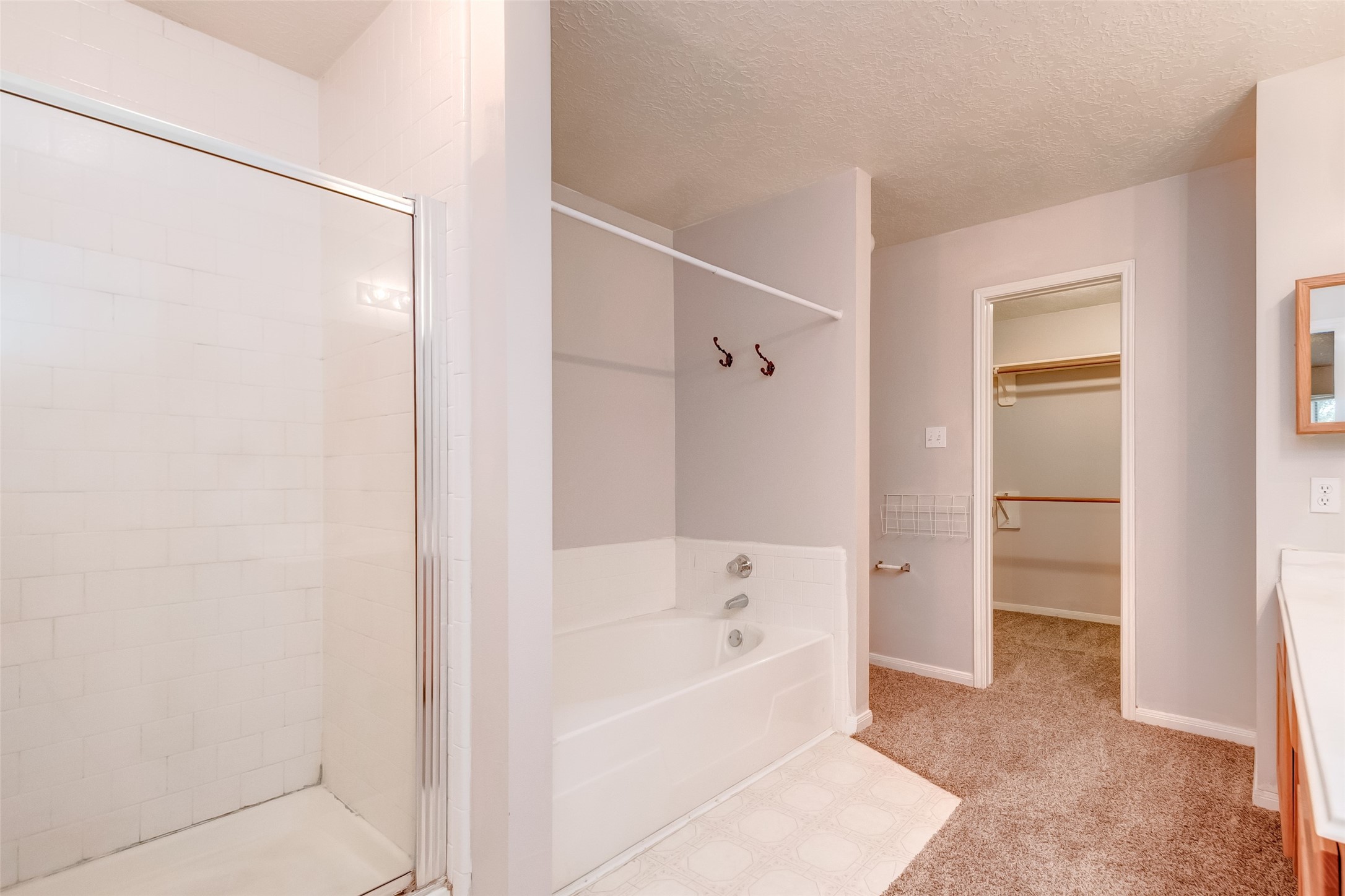 12654 Pine Bush Drive Houston, TX 77070 - Photo 28 of 35 a bathroom with a bathtub and a shower