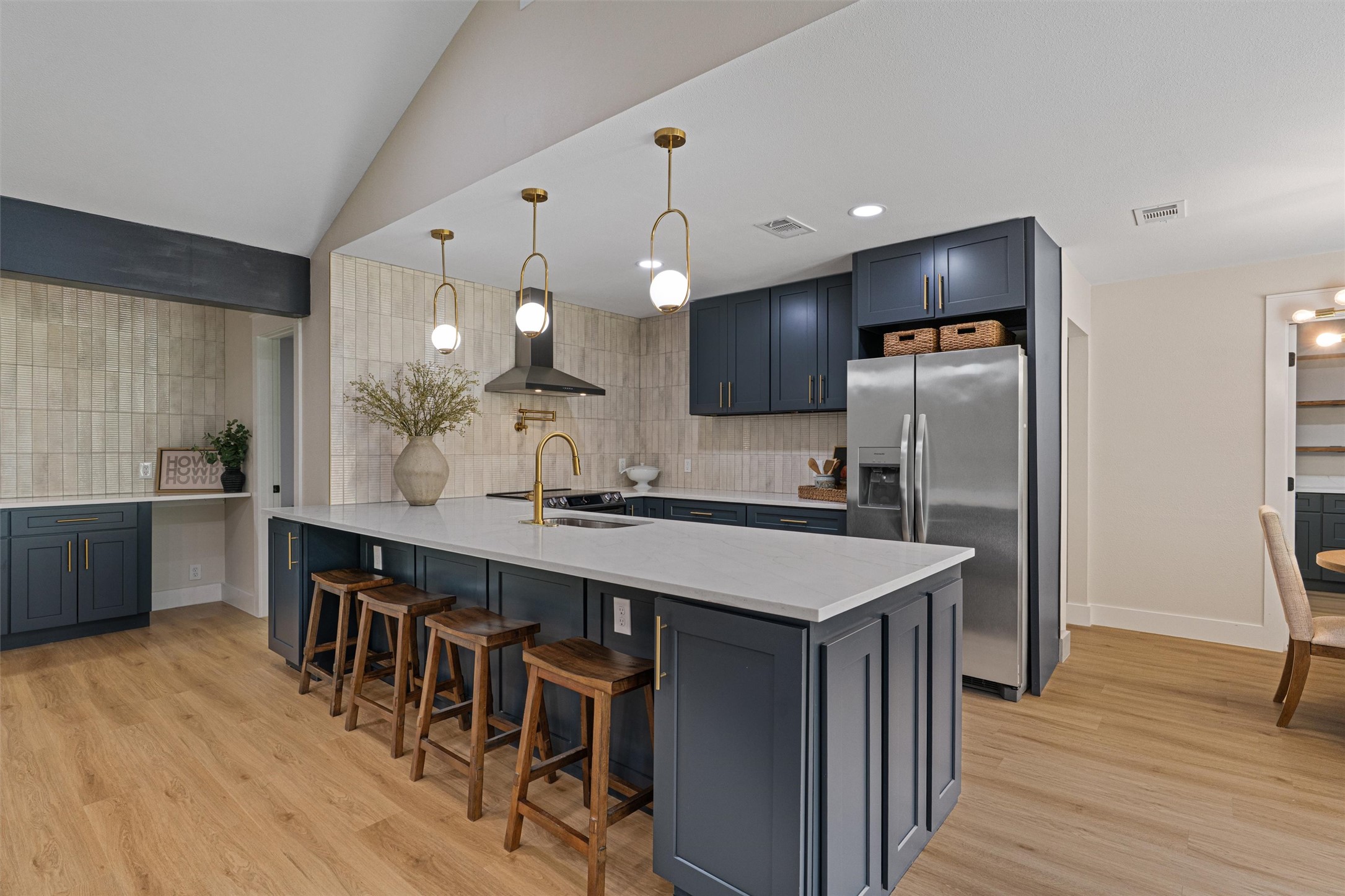 224 Clear Spring Road Georgetown, TX 78628 - Photo 14 of 40 a kitchen with kitchen island granite countertop a sink a center island and stainless steel appliances
