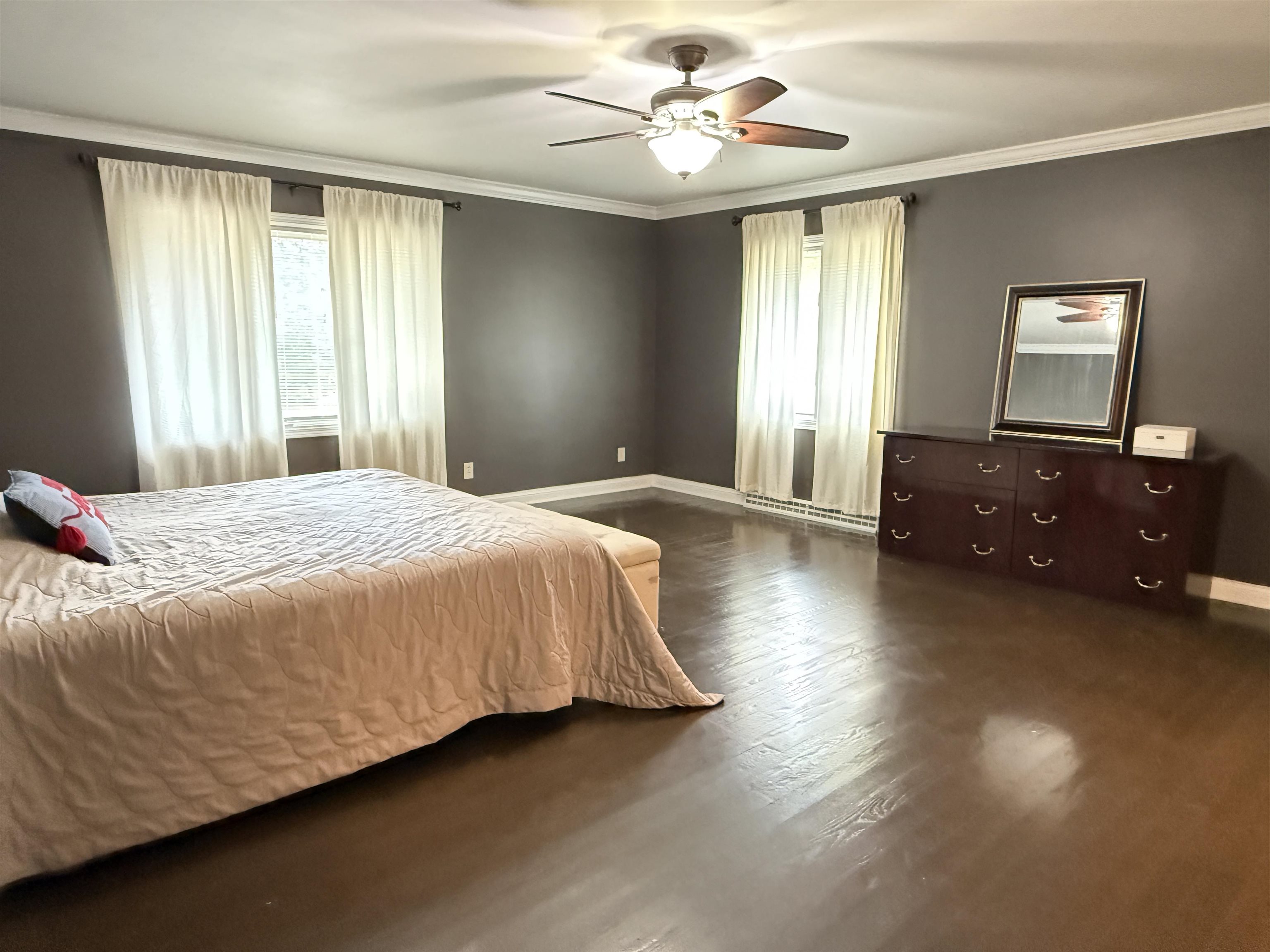 402 West Le Fevre Road Sterling, IL 61081 - Photo 18 of 39 a spacious bedroom with a bed and a chandelier