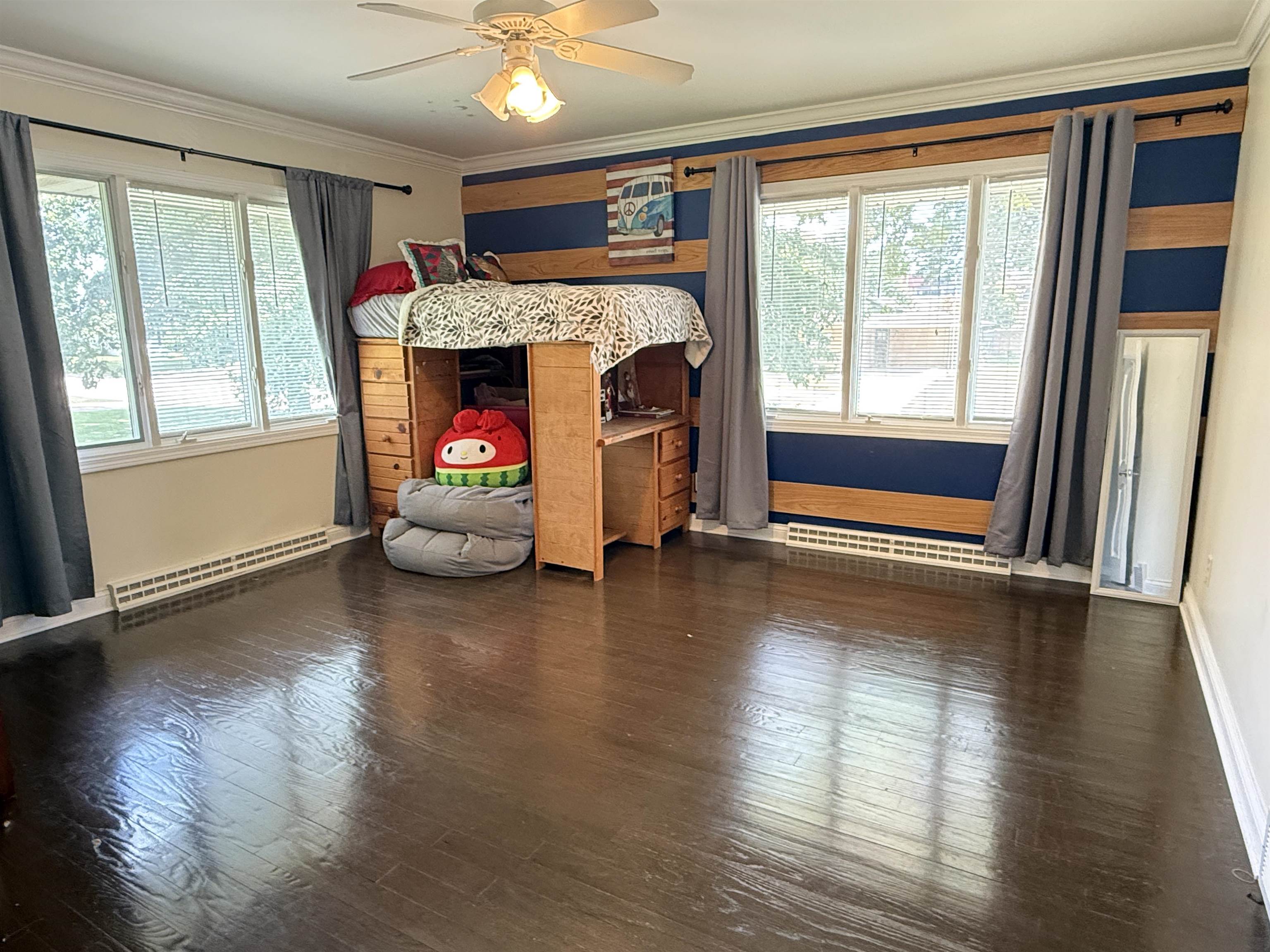 402 West Le Fevre Road Sterling, IL 61081 - Photo 24 of 39 a hallway with wooden floor fireplace and windows