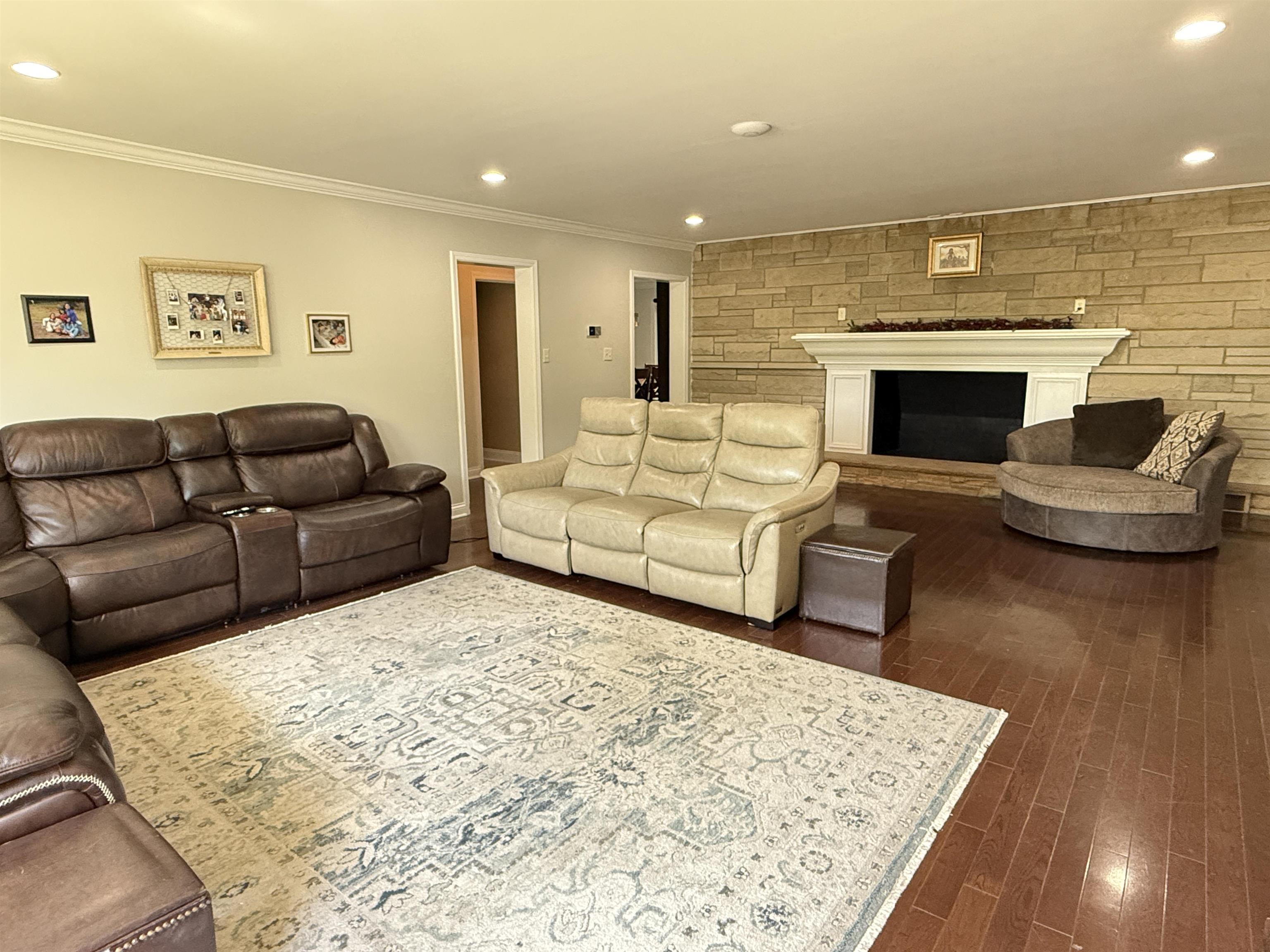 402 West Le Fevre Road Sterling, IL 61081 - Photo 3 of 39 a living room with furniture and a fireplace