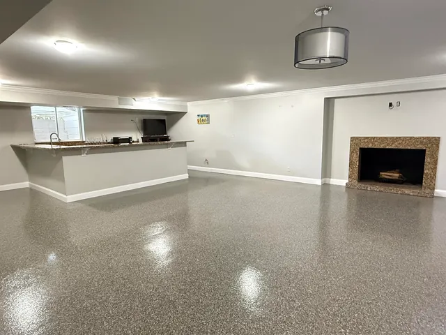 a view of a livingroom with kitchen and furniture