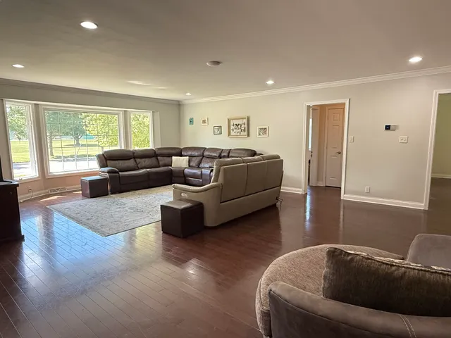 a living room with furniture window and couch