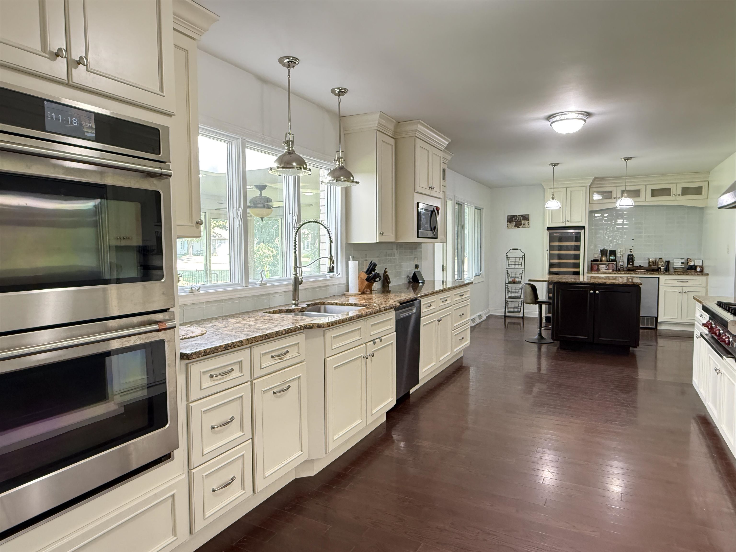402 West Le Fevre Road Sterling, IL 61081 - Photo 7 of 39 a large kitchen with cabinets and stainless steel appliances