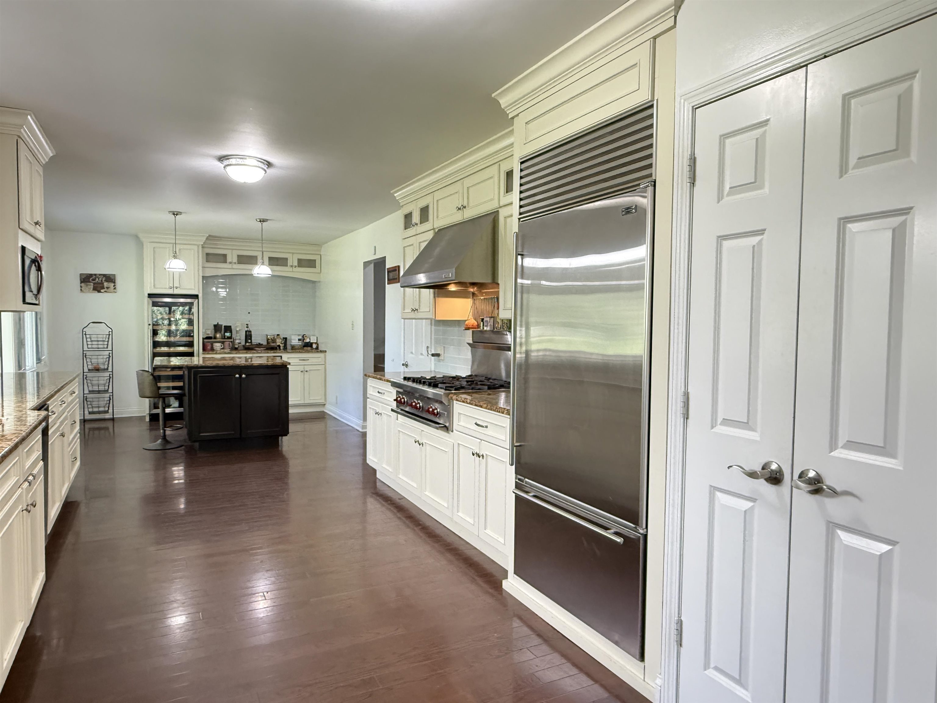 402 West Le Fevre Road Sterling, IL 61081 - Photo 8 of 39 a kitchen with a refrigerator and a sink