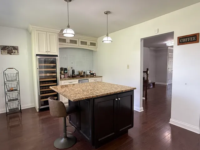 a open kitchen with a table and chairs in it