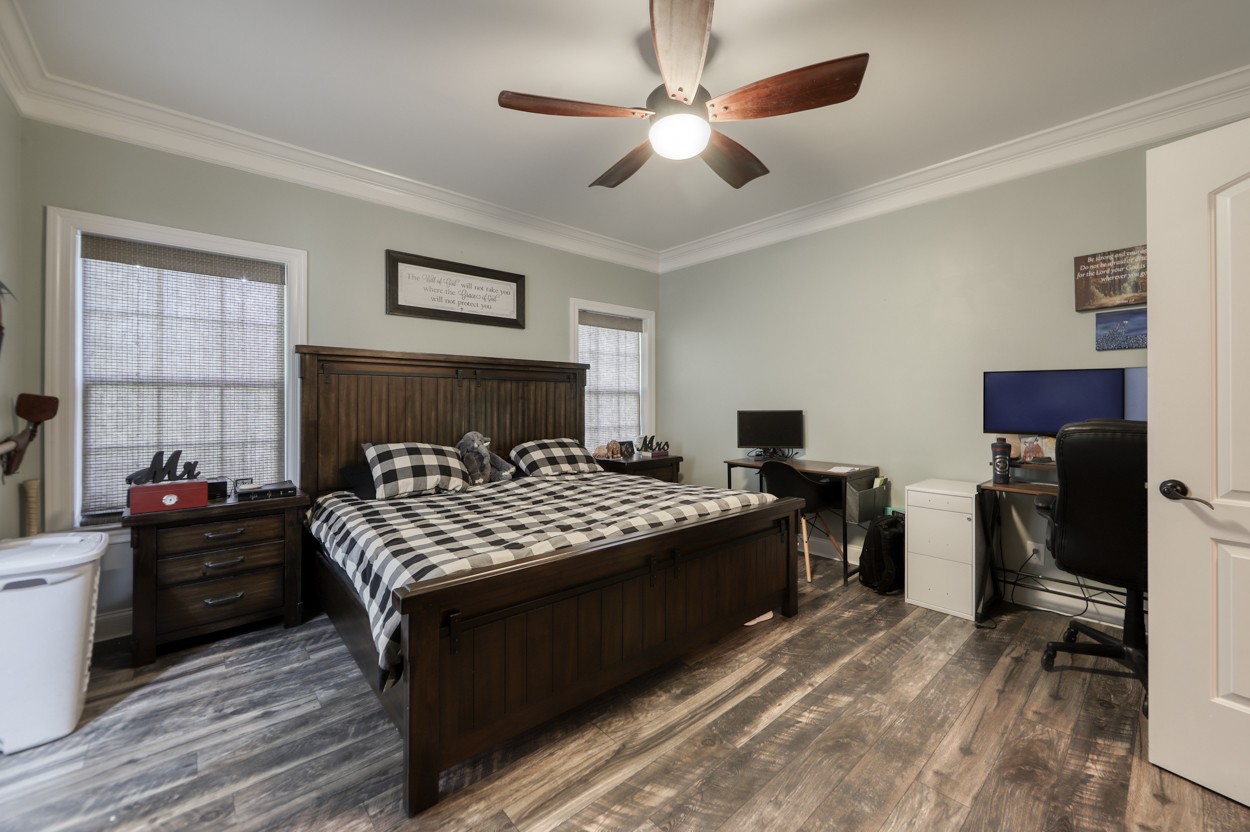 65 Sheltontown Road Manchester, TN 37355 - Photo 16 of 46 a bedroom with a bed and a chandelier