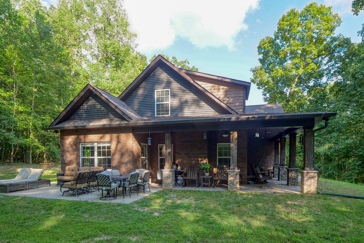 65 Sheltontown Road Manchester, TN 37355 - Photo 34 of 46 a front view of a house with garden and porch