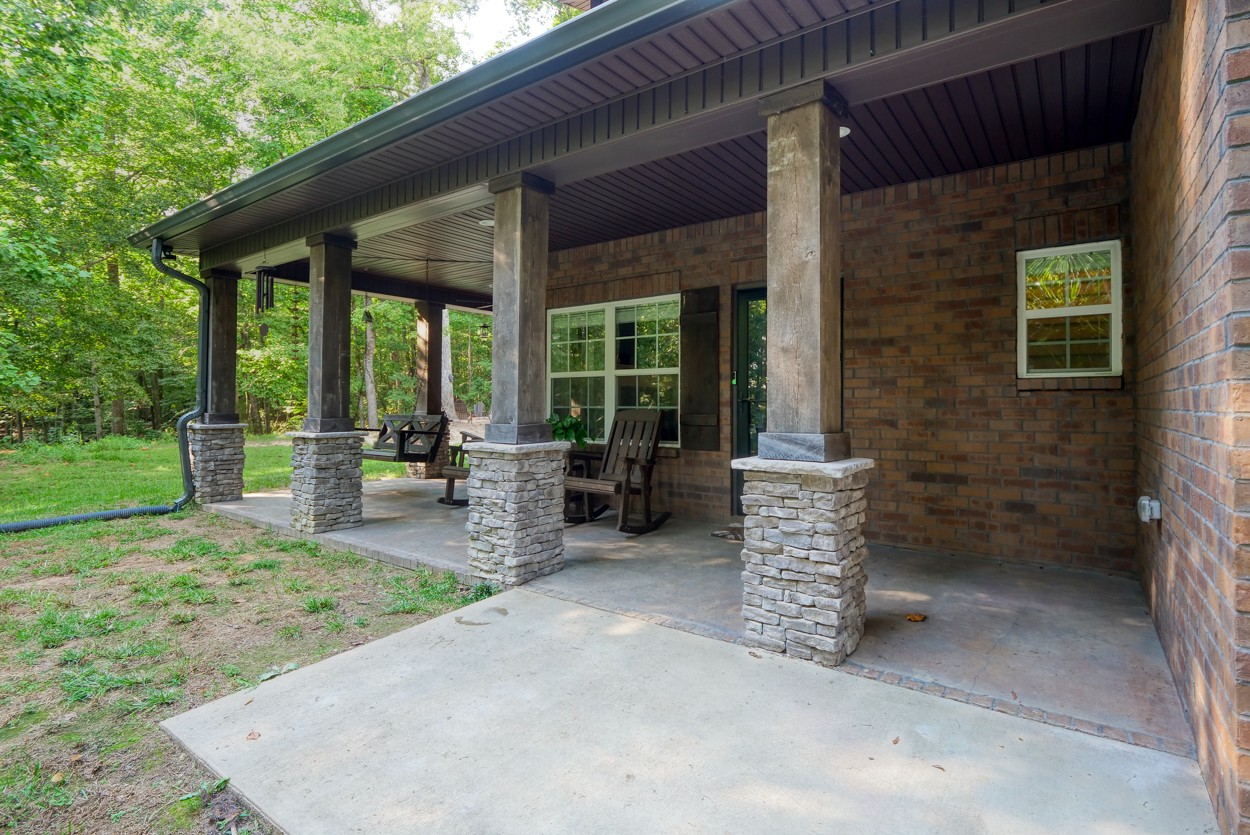 65 Sheltontown Road Manchester, TN 37355 - Photo 35 of 46 a view of a patio with a table and chairs and a barbeque
