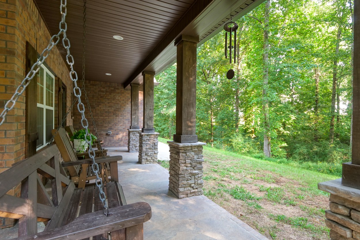 65 Sheltontown Road Manchester, TN 37355 - Photo 37 of 46 a view of a patio with table and chairs and potted plants