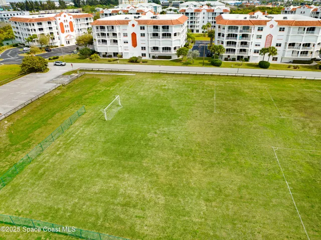 a room with pool table and windows