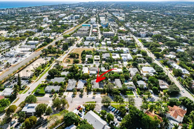 an aerial view of residential houses with city view