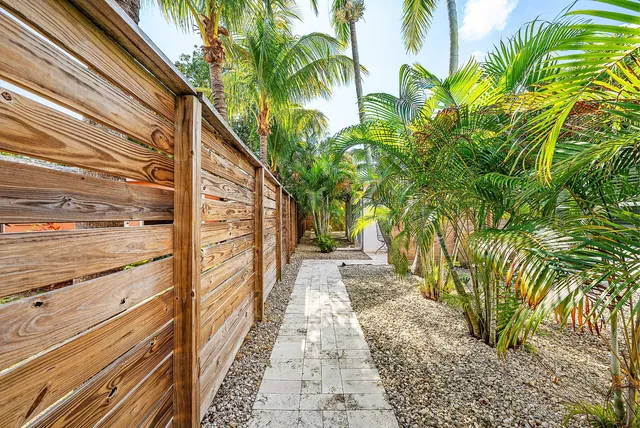 a view of a pathway both side of a house